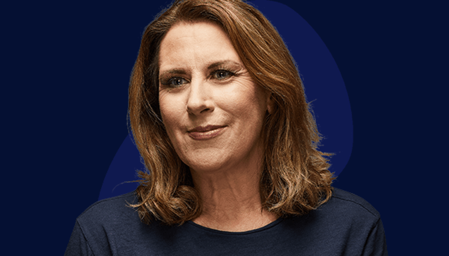 Rose - personal story Image of current police officer smiling to the left of camera wearing navy blue smart casual top. Late forties, female with light skin and shoulder-length light brown hair.